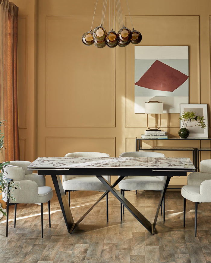 A dining room setup featuring a marble-topped table, elegant chairs, and a sleek console table.