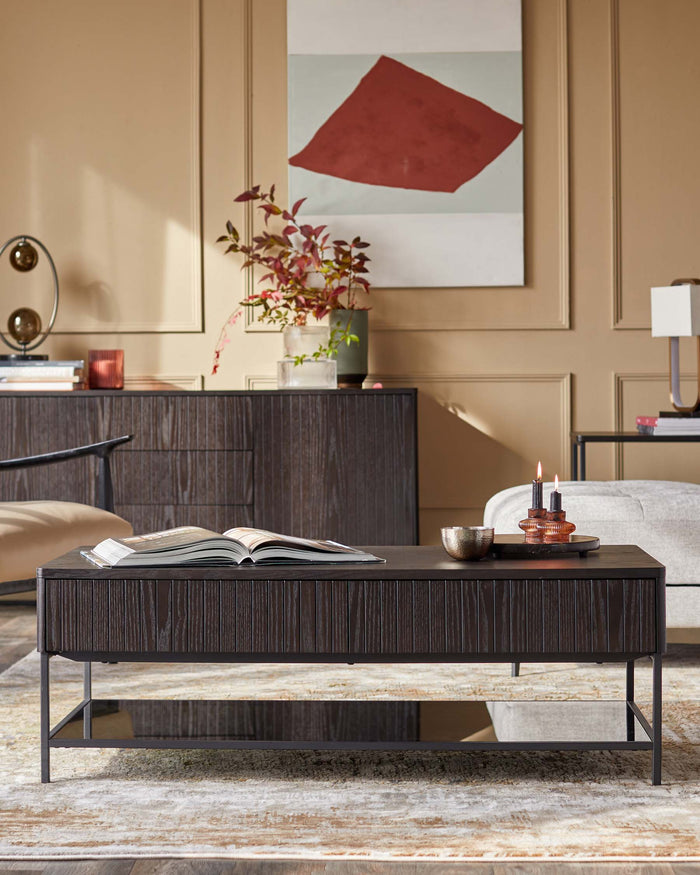 A stylish living room scene with a dark wood coffee table, sideboard, and modern art, creating a sophisticated atmosphere.