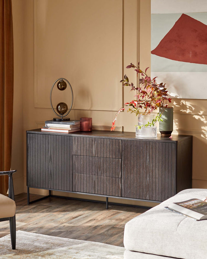 Stylish sideboard with drawers, displaying decorative items. A modern and elegant furniture piece.