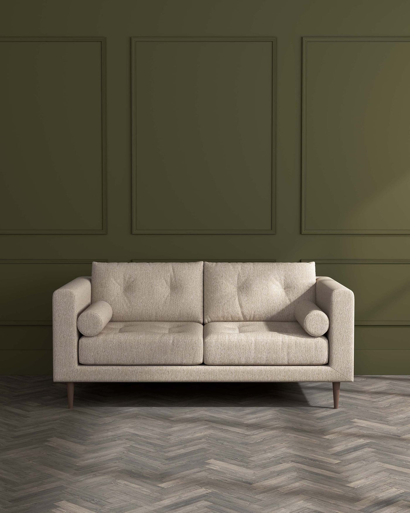 A modern three-seater sofa with a textured beige upholstery, featuring clean lines, square padded cushions, and cylindrical armrest bolsters. It is supported by four round, tapered wooden legs, set against a herringbone-patterned wood floor and olive green panelled wall background.