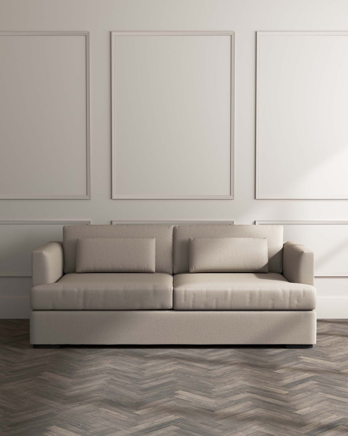 Modern three-seater sofa in a neutral beige fabric with clean lines and square armrests, set against a light grey wall with subtle panel detailing and herringbone-patterned wooden flooring.