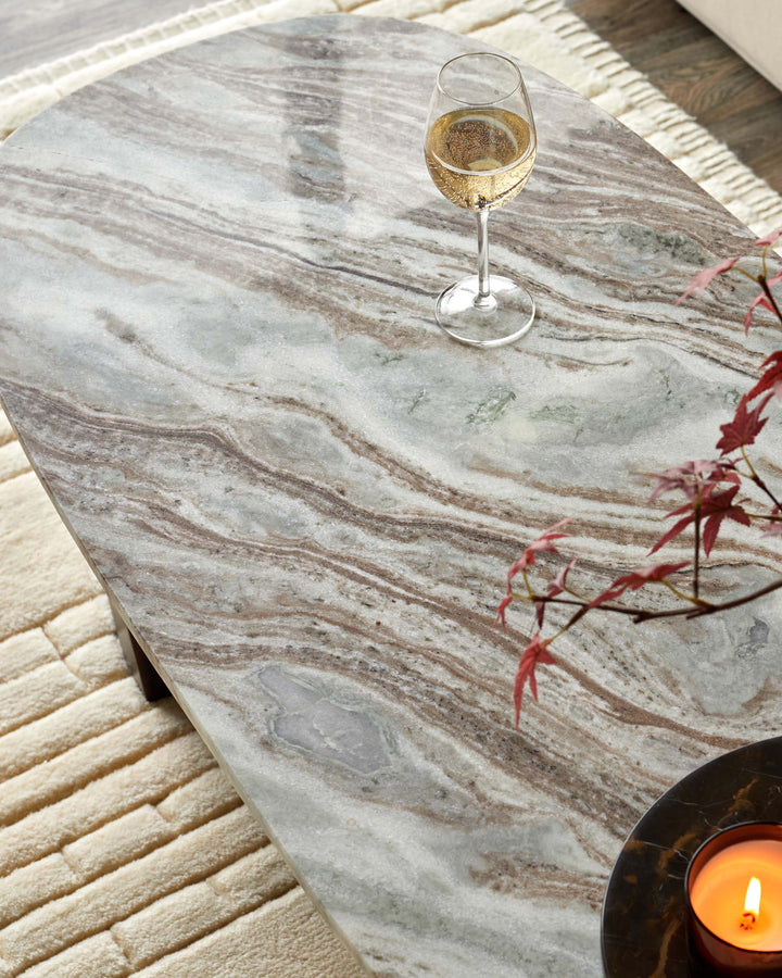 Marble coffee table with wine glass and candle creating a modern, stylish and elegant centrepiece for your living room.