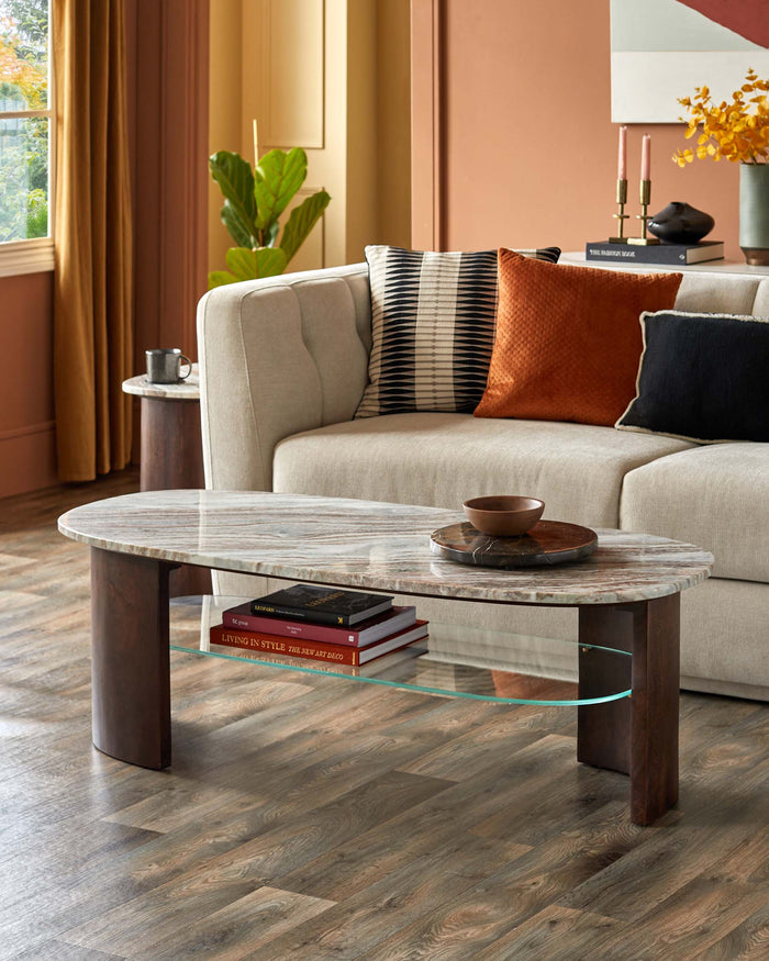 A stylish living room featuring a marble-topped coffee table, a comfortable sofa, and a wooden side table.