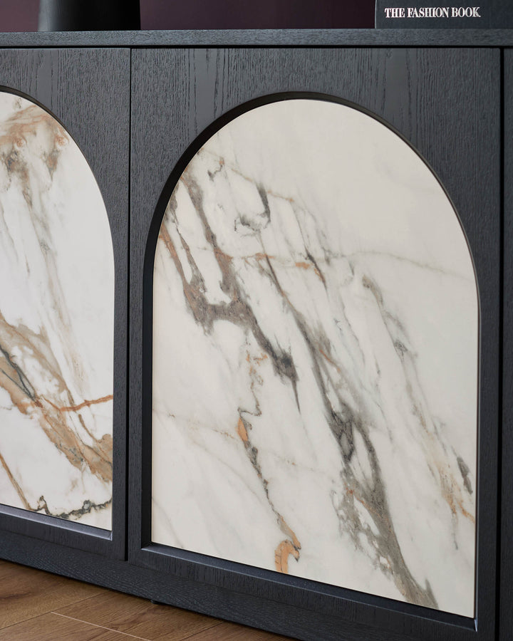Archie large sideboard with arched doors featuring white marble ceramic top and dark wood frame, angled view.