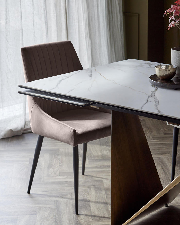 Stylish dining set with a marble-effect table and comfortable velvet chair, perfect for modern homes.