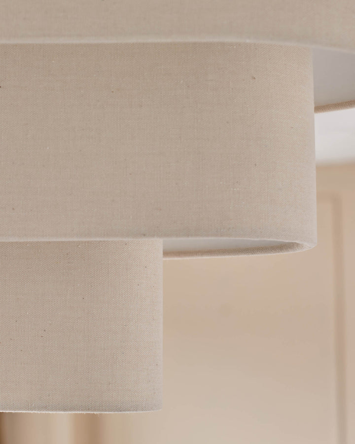 Burleigh 2-bulb pendant light with natural linen shades, close-up detail of cylindrical fabric texture.