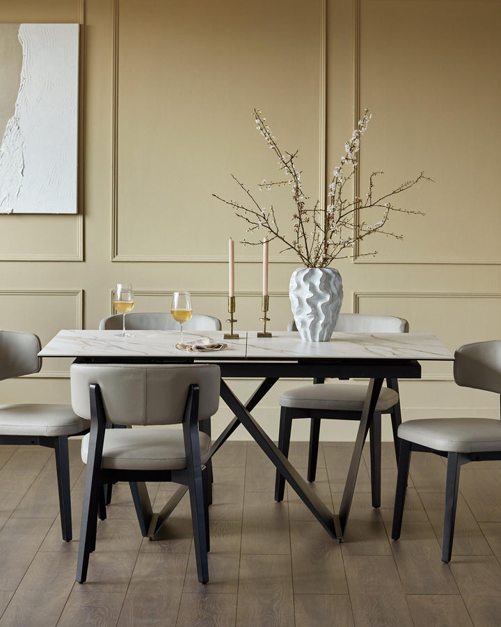 A modern marble dining table with grey leather chairs. A sleek, stylish dining set for contemporary homes.
