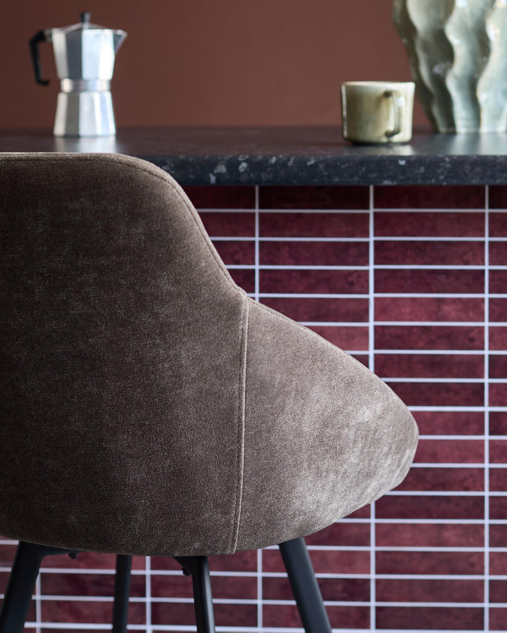 Close-up of a brown upholstered chair. A stylish seating option for the modern home.