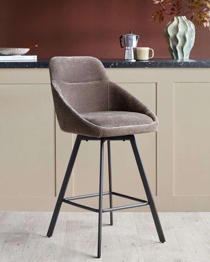 A stylish brown bar stool with a black frame sits in front of a kitchen counter.