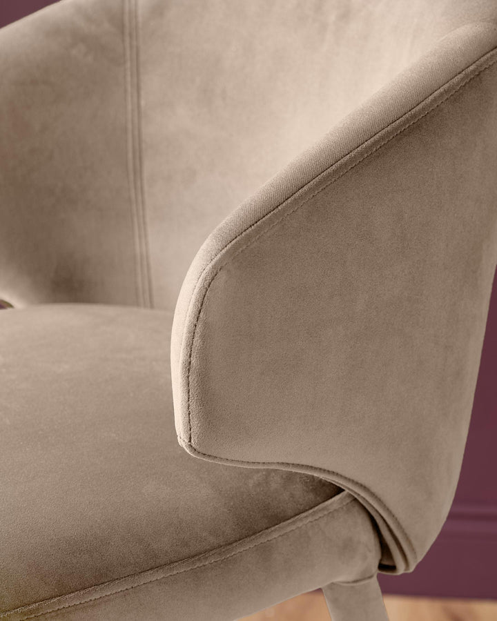Ethan bar stool in champagne velvet, close-up of curved backrest and seating area showing soft upholstery texture.