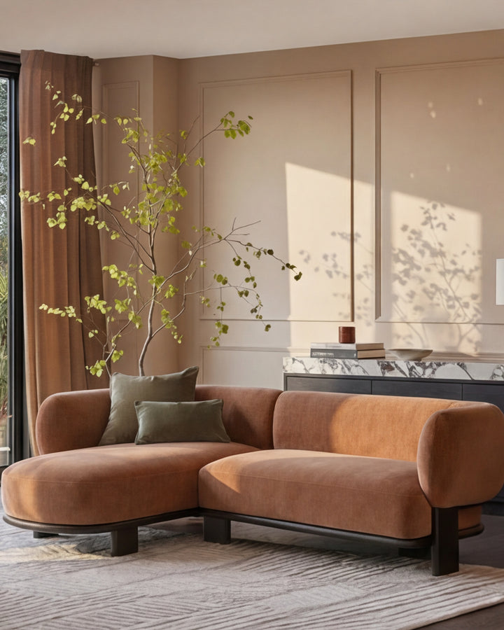 Florence left-hand-facing chaise sofa in apricot fabric with dark wood base, displayed in a beige living room.