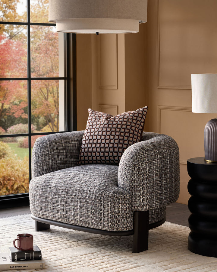 Florence armchair in dark chocolate weave fabric with dark wood legs, shown in a styled living room setting.