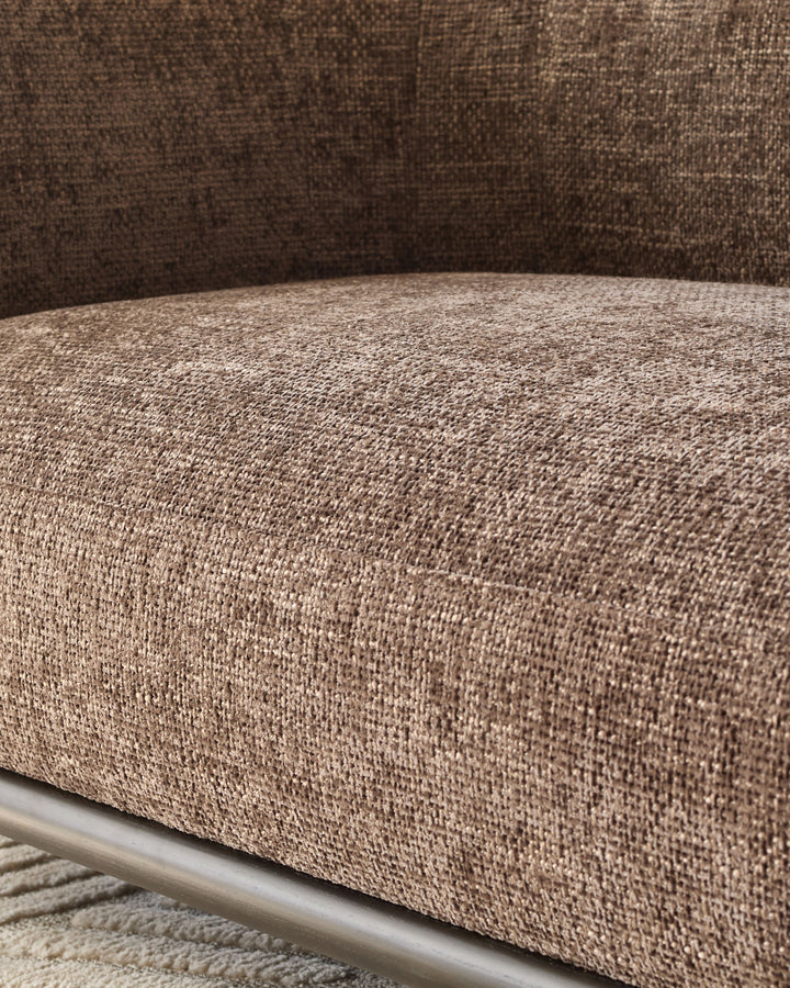 Close-up of mocha fabric texture on Florence 2-seater sofa arm with metal frame detail visible.