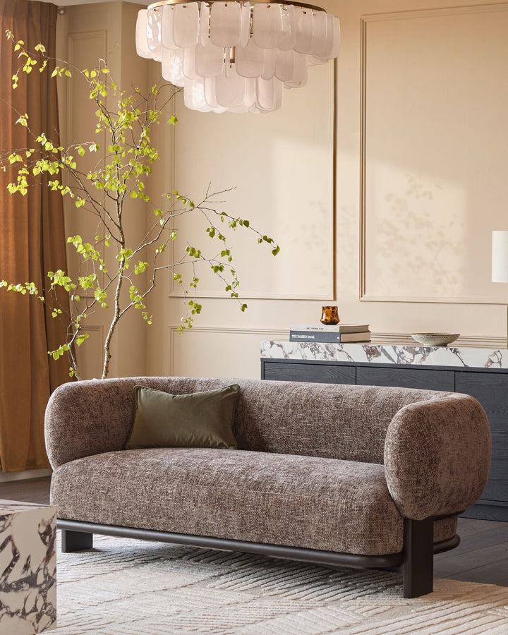 Florence 2-seater sofa in mocha fabric with dark wood frame, curved arms, displayed in a styled living room setting.