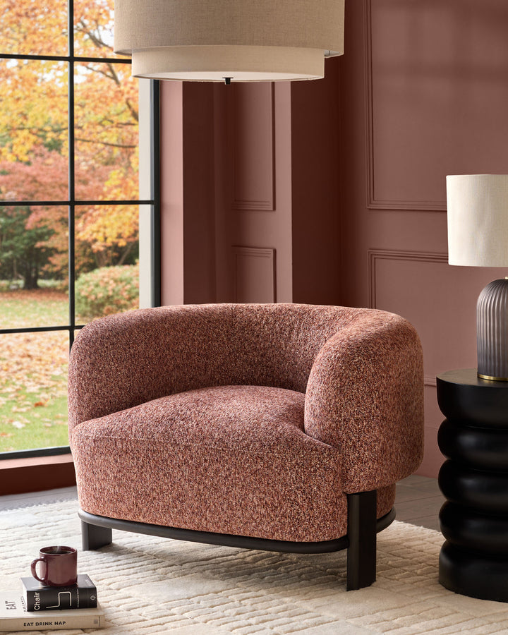 Florence armchair in toffee-red weave fabric with dark wood base, displayed in a styled interior setting.