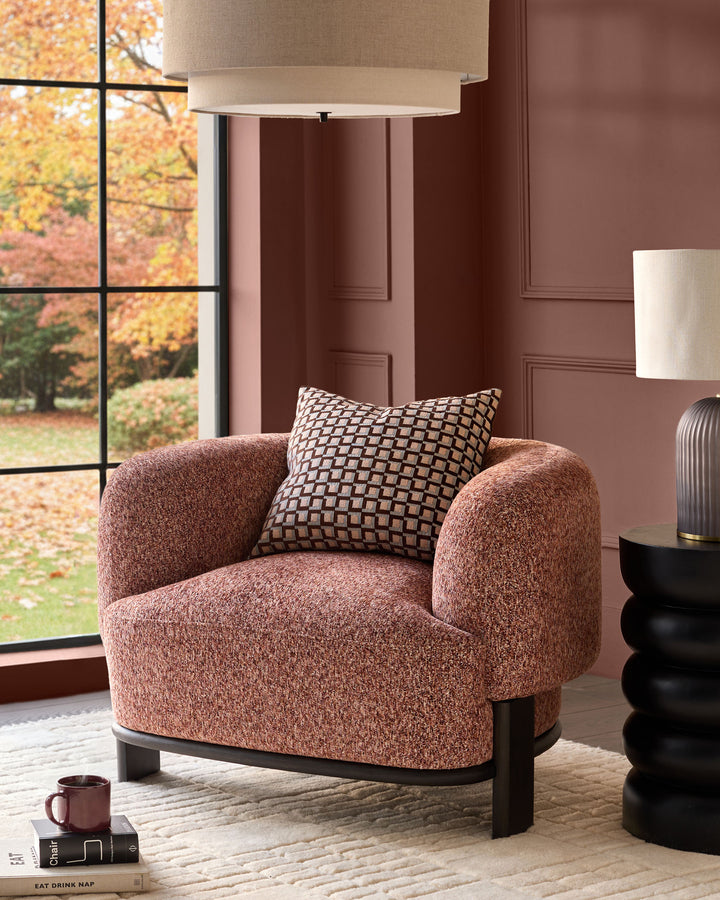 Florence armchair in toffee weave fabric with dark wood legs, styled in a warm autumn room setting with geometric pillow.