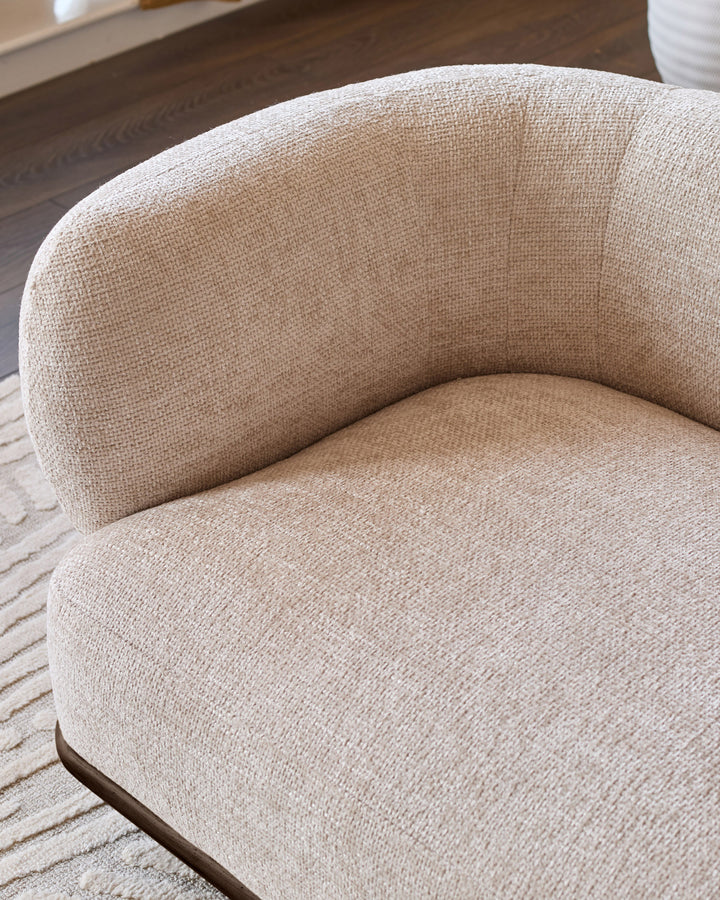 Florence 2-seater sofa in natural fabric with curved design and dark wood base, shown at side angle.