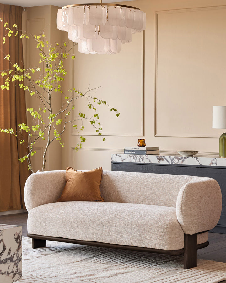 Florence 2-seater sofa in natural fabric with dark wood legs, displayed in a modern living room setting.