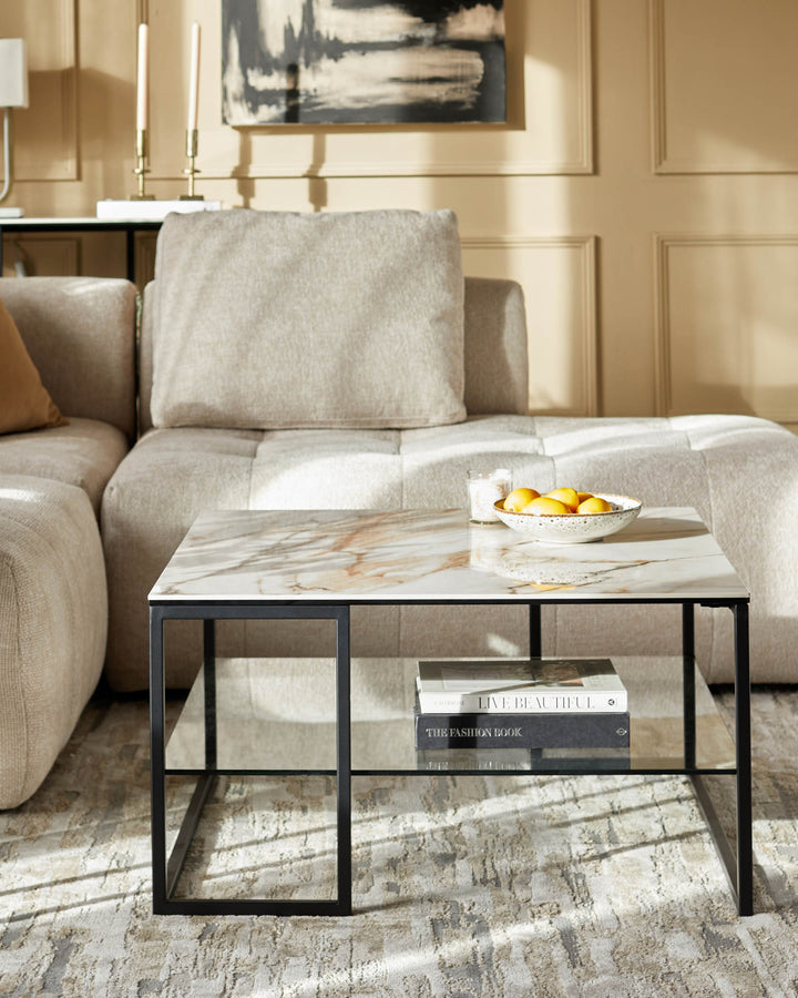 A modern coffee table with a marble top and black metal frame, placed in front of a neutral-toned sofa.