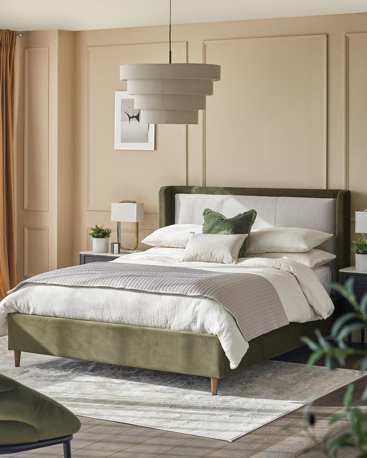 Stylish bedroom featuring a green upholstered bed, layered bedding, bedside tables, and a multi-tiered pendant light.