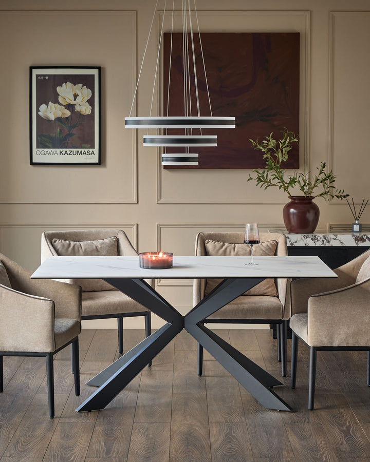 Hayden 6-seater dining table with white ceramic top and black X-frame base in modern dining room setting.