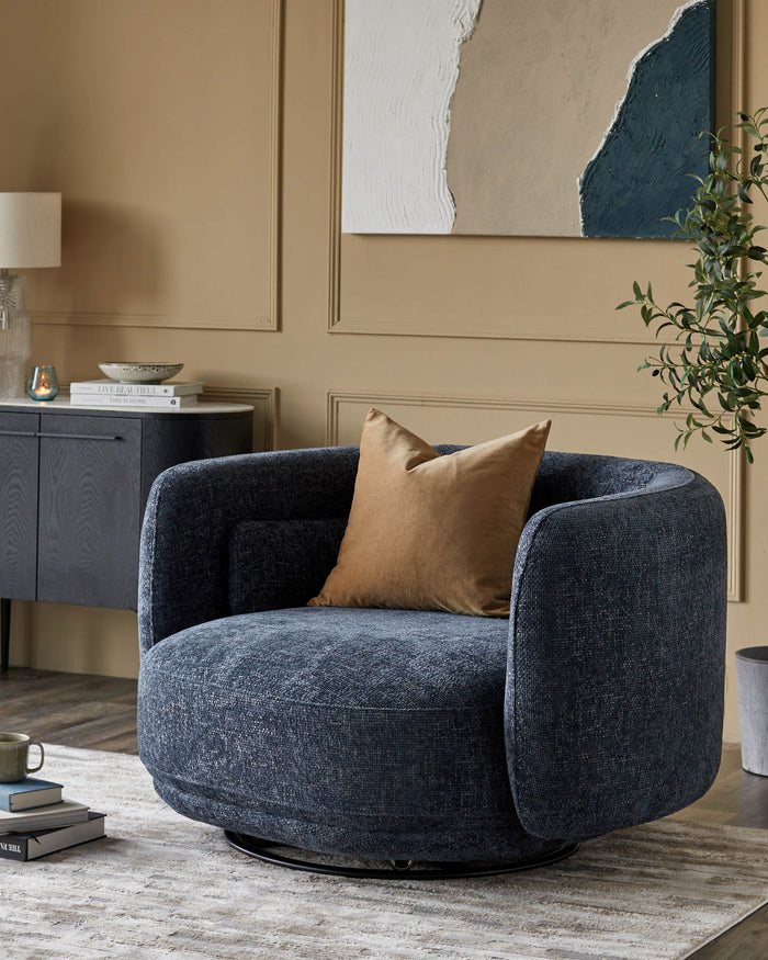 A cosy swivel chair with a golden pillow takes centre stage against a neutral backdrop in a stylish living room setting.