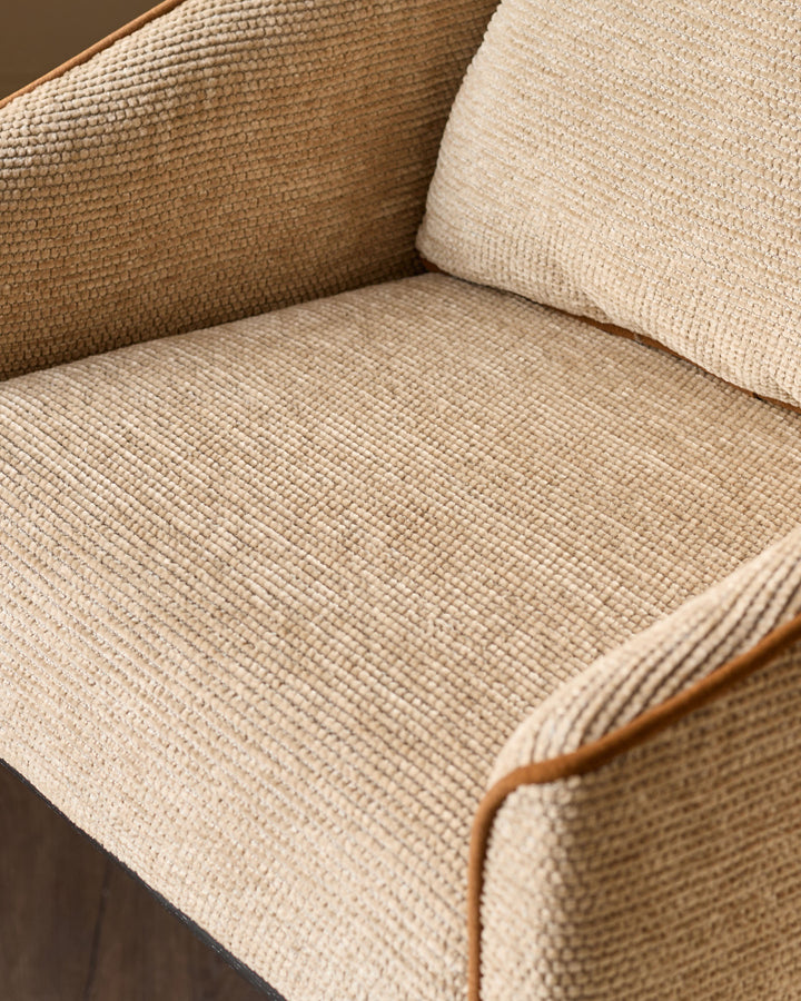 Julep bar stool in honey fabric, close-up view showing textured weave and wooden armrest detail.