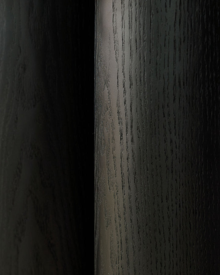 Dark wood console table with natural wood grain texture and finish, angled side view.