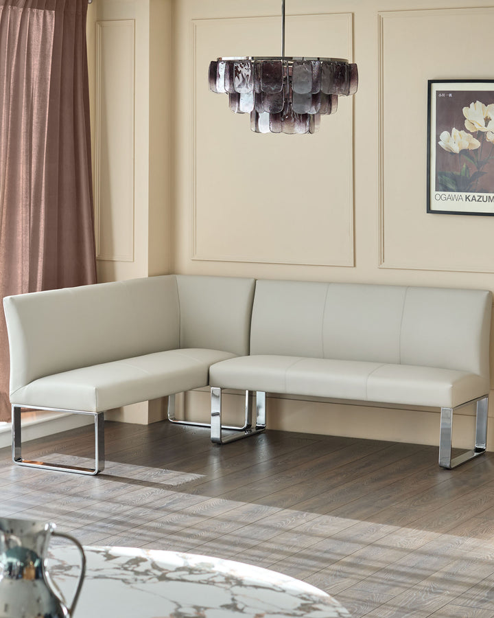 Light grey faux leather 5-seater corner dining bench with chrome legs, shown in modern room setting.
