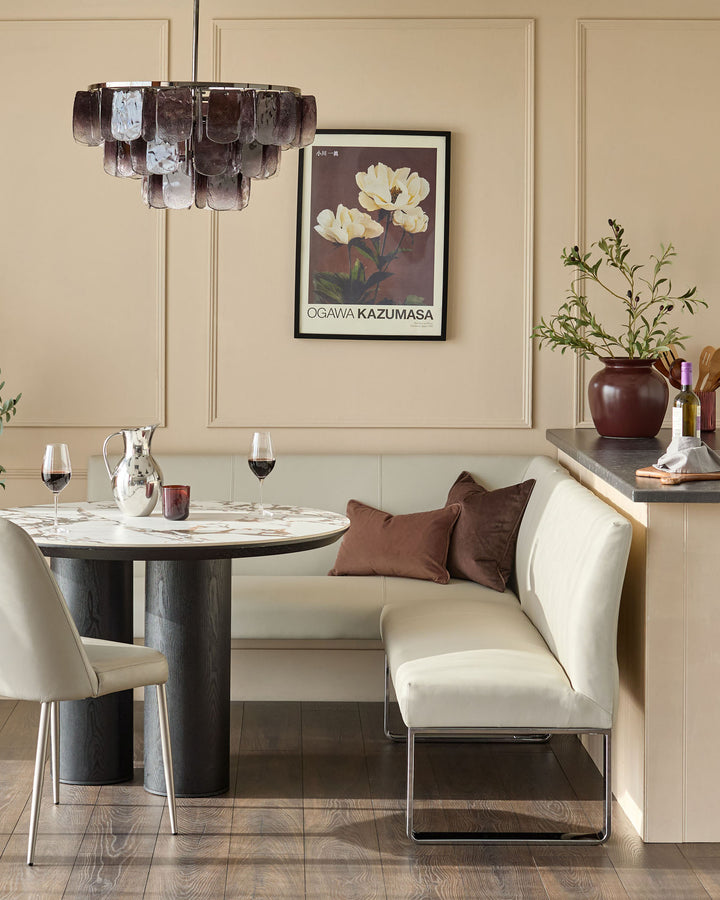 Loop 5-seater right-hand corner dining bench in light grey faux leather with chrome legs, styled in elegant dining setting.