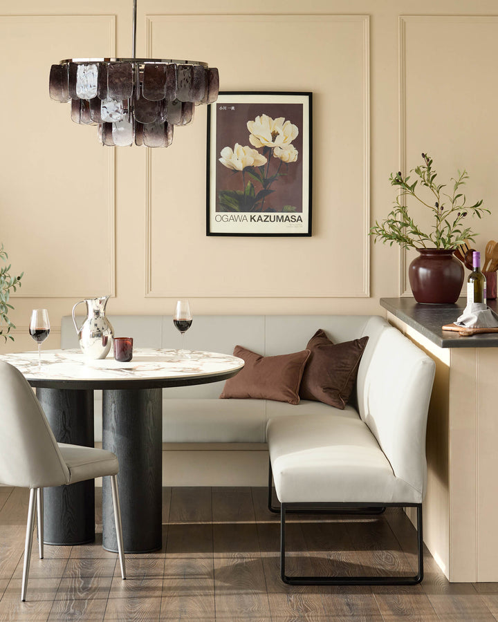 Light grey upholstered corner bench with black metal legs, right-hand orientation, shown in modern dining setting.