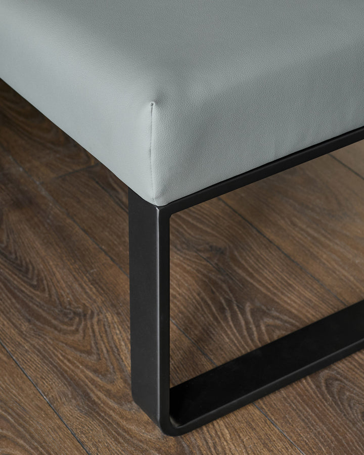 Loop 5-seater left-hand corner bench with mid-grey upholstery and black metal legs, angled detail view.