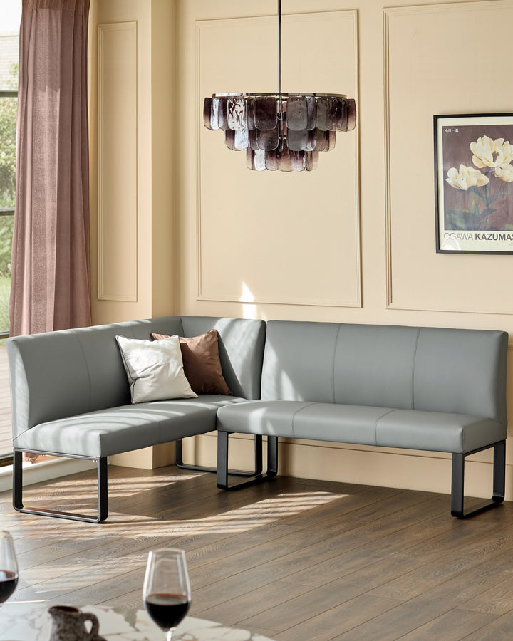 Grey leather corner bench with black metal legs, right-hand configuration, in modern living room setting with pendant light.