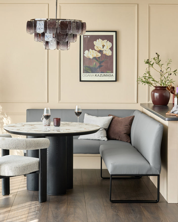 Loop 5-seater right-hand corner bench in mid-grey with black legs, styled in modern dining setting.