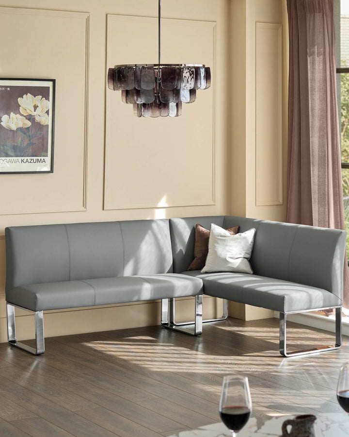 Loop 5-seater left-hand corner dining bench in mid-grey faux leather with chrome legs, shown in a modern room setting.