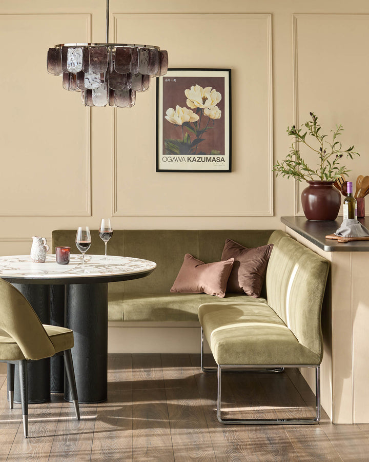 Loop 5-seater right-hand corner bench in olive green velvet with chrome legs, styled in dining setting.