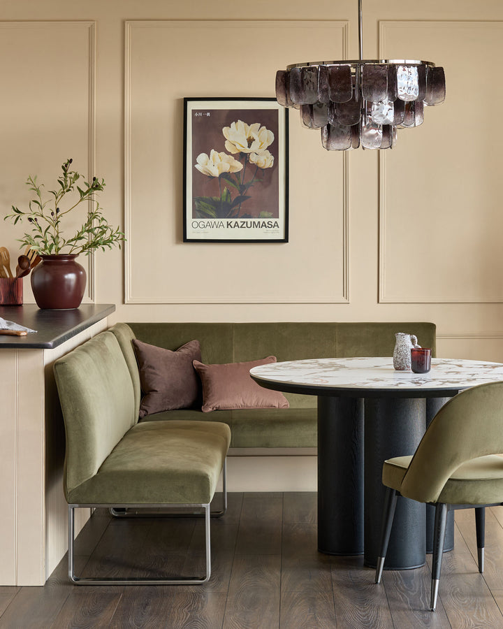 Olive green 5-seater left-hand corner bench with stainless steel legs in modern dining room setting.