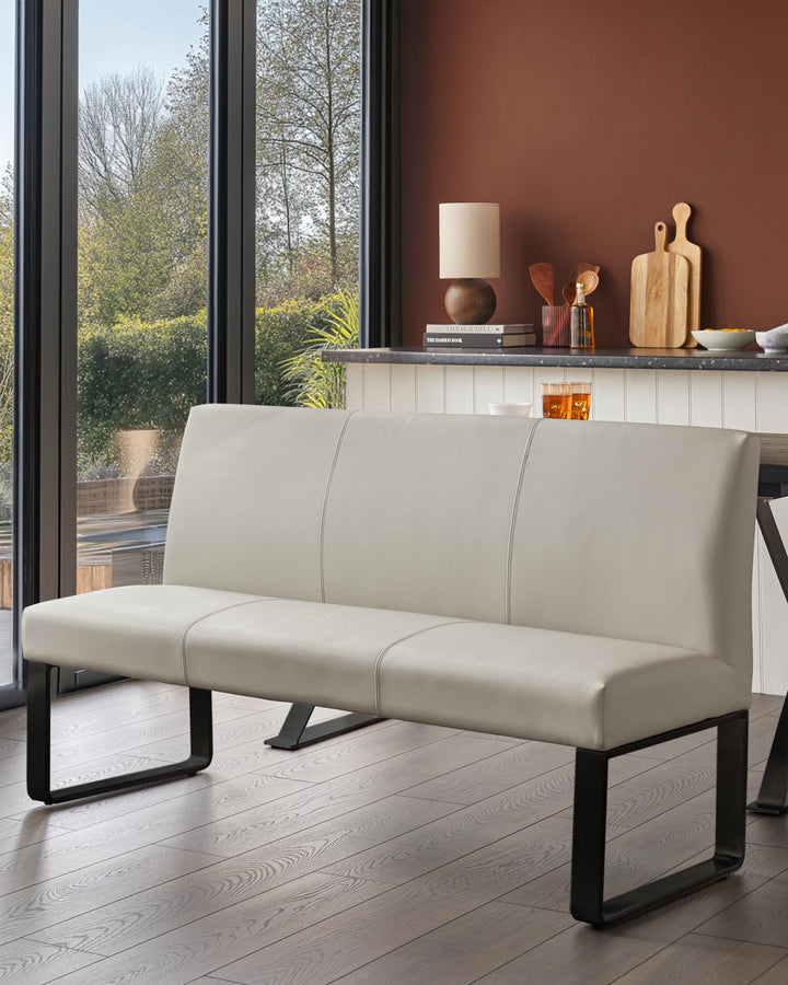 Stylish light grey bench with a sleek, modern design. Black legs and minimalist style.