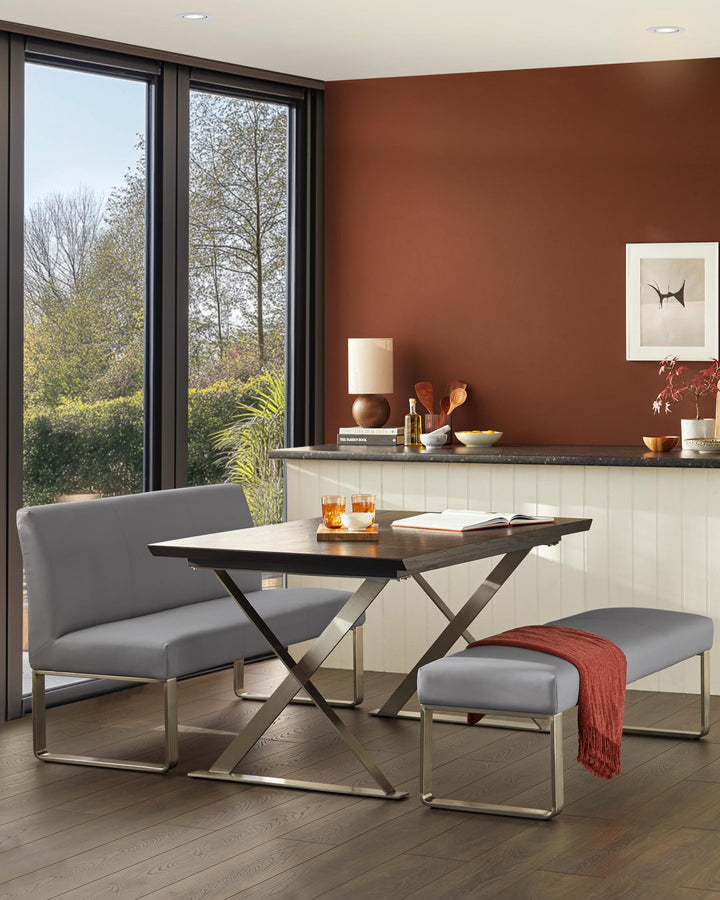 Modern dining set featuring a table, benches and a built-in counter, all in a contemporary style.