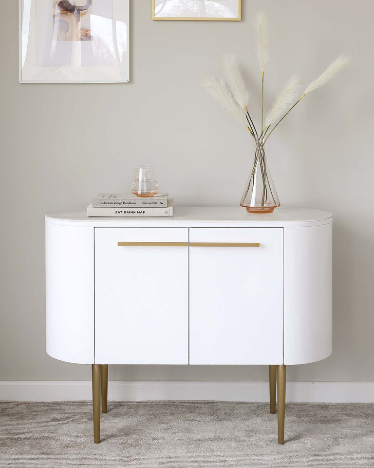 Elegant modern white curved sideboard with gold-coloured tapered metal legs and matching gold handles.