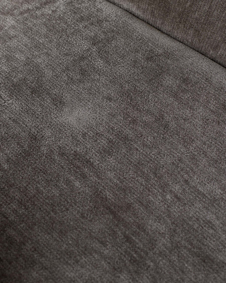 Close-up of textured brown fabric. Ideal for a modern sofa or chair upholstery, showcasing quality and style.