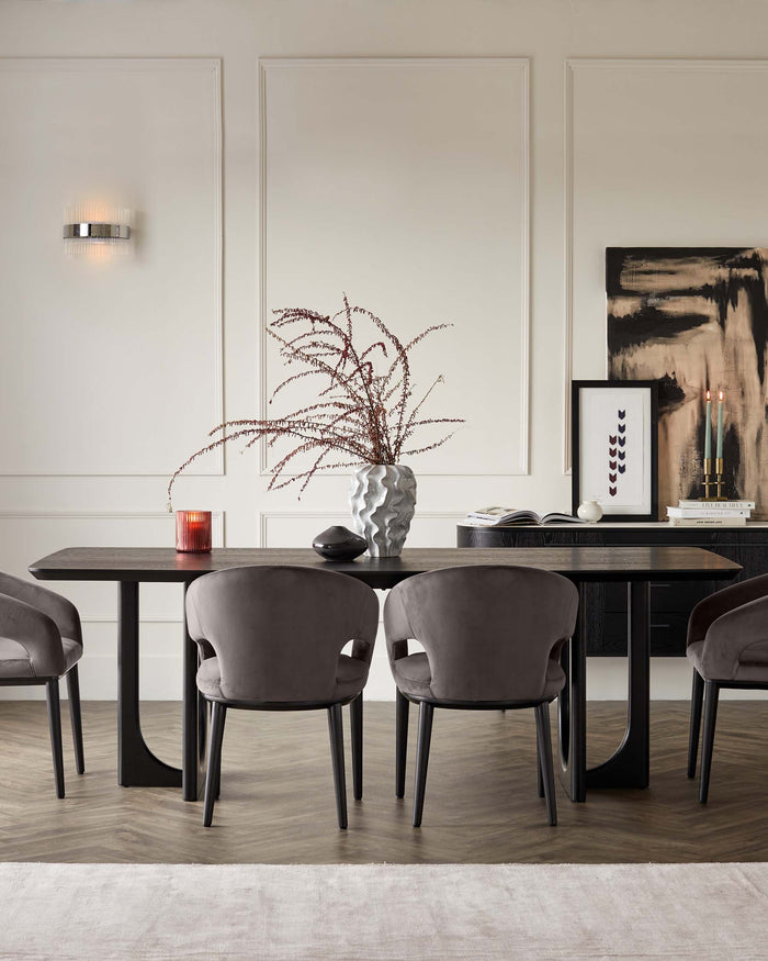 Modern minimalist dining room furniture set with a sleek, dark wood rectangular table and four plush, grey upholstered chairs with black legs, arranged on a subtle off-white area rug, creating a stylish and sophisticated interior.