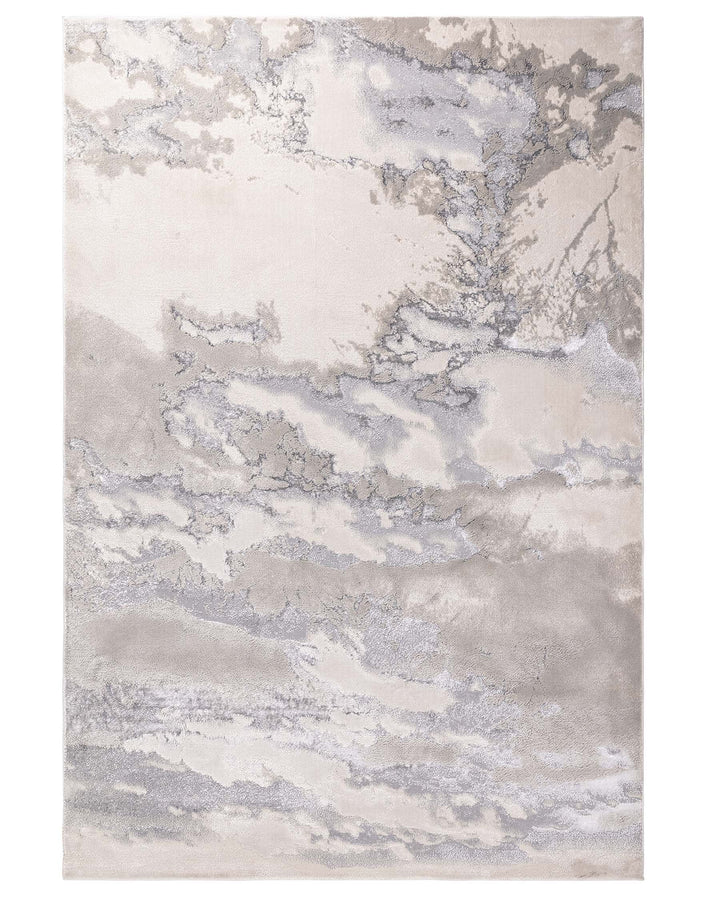 A neutral coloured rug with a marbled effect in soft shades of beige, grey and silver.
