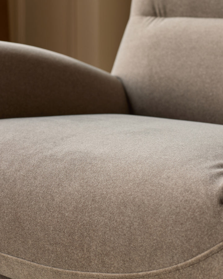 Piper accent chair in mocha fabric, close-up detail of curved seat and armrest cushioning.
