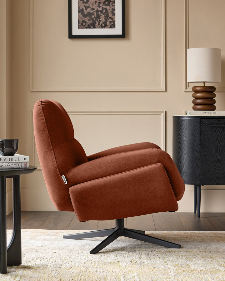 Toffee-red Piper accent chair with footstool on black swivel base, shown in modern living room setting.