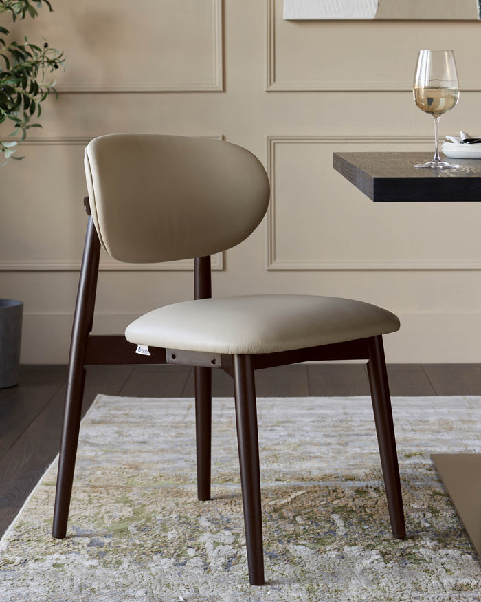 A modern wooden dining chair with a curved back and beige upholstery, sat on a patterned rug in a neutral toned room.