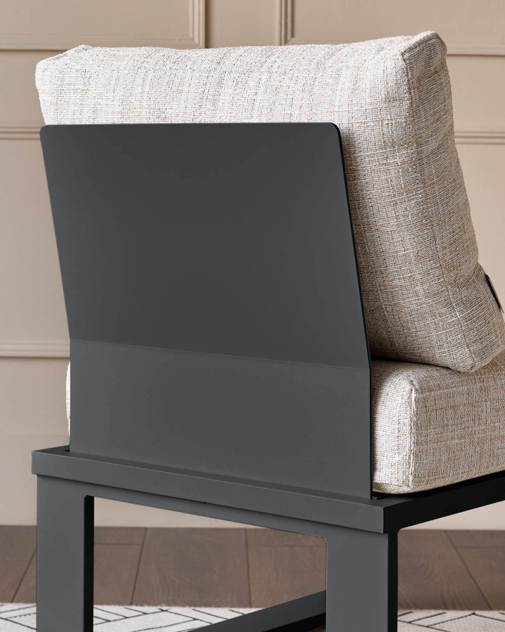 Savannah garden corner bench with black metal base and natural cushioned seating, side view.
