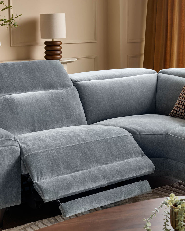 Blue-grey fabric right-corner recliner sofa with footrest extended, shown in modern living room setting.