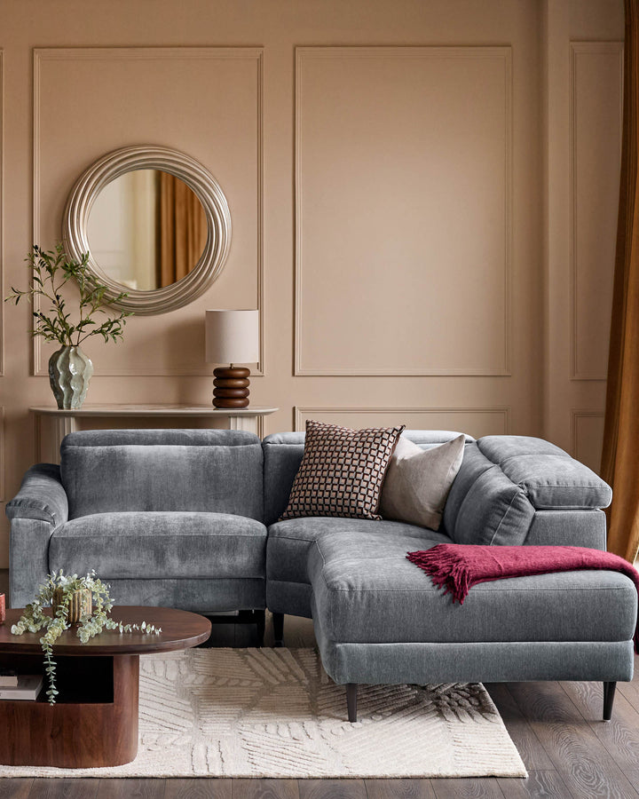 Serene right small corner recliner sofa in blue-grey fabric, displayed in a modern living room setting with complementary décor.