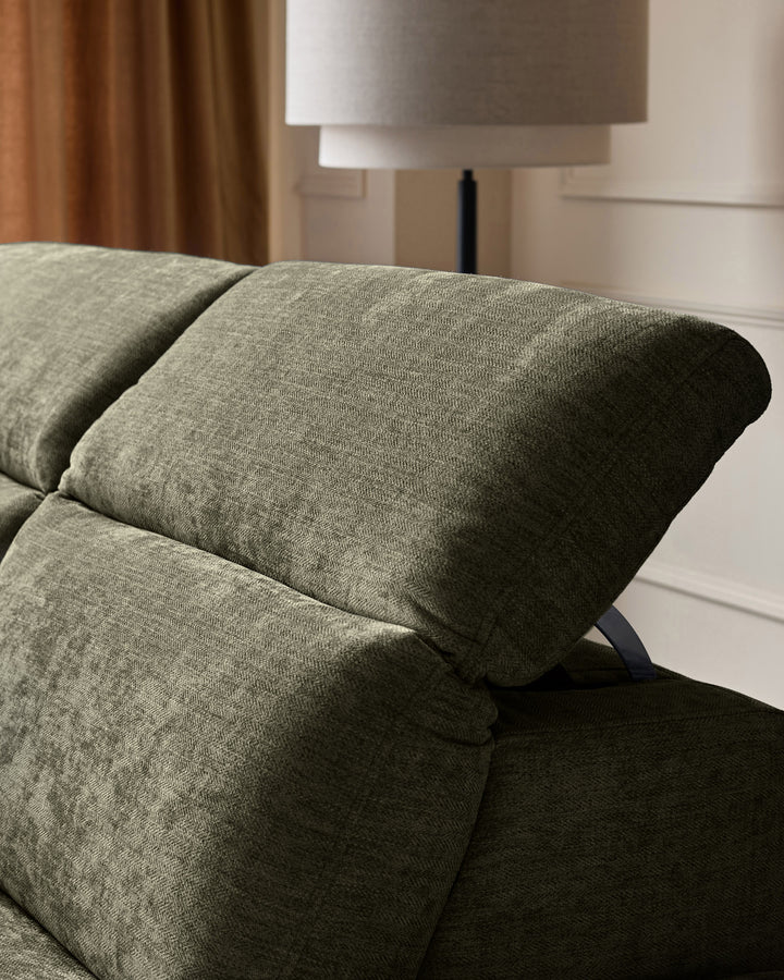 Serene left chaise recliner sofa in dark green chenille, close-up of rolled arm and cushioned seat detail.